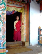 Boy Monk in doorway