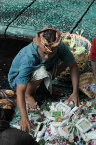 This man was collecting the offerings from a ceremony in the holy waters.