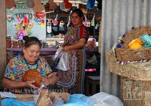 Two women selling bread.